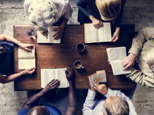 studying-bibles-together-around-wooden-table-2026-01-07-23-30-41-utc (1).jpg